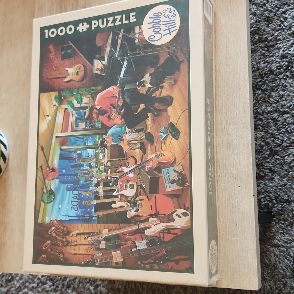Cobble hill 1000 puzzle "Crossroads Music Store" 67.6 cm X 48.9cm